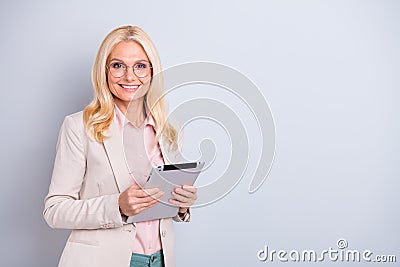 Portrait of her she nice-looking attractive stylish cheerful cheery wavy-haired lady hr manager holding in hands e-book Stock Photo