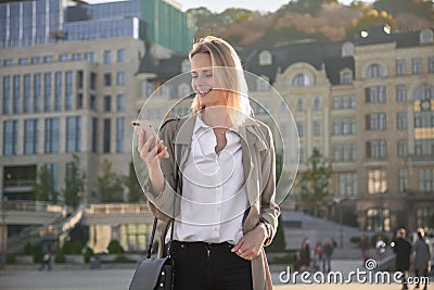 Portrait of her she nice lovable fascinating winsome attractive lovely sweet cheerful girl holding cell in hands reading sms Stock Photo