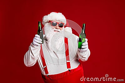 Portrait of his he attractive cheerful funny fat white-haired Santa holding in hand beer bottles dancing chill having Stock Photo