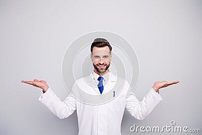 Portrait of his he nice attractive cheerful cheery doc holding on palms copy space new solution alternative traditional Stock Photo