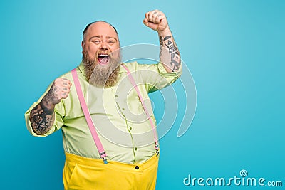 Portrait of his he nice attractive cheerful cheery satisfied glad bearded mature guy celebrating best attainment Stock Photo