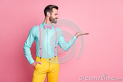 Portrait of his he nice attractive imposing elegant glad content cheerful cheery bearded guy artist holding on palm gift Stock Photo