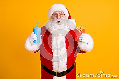 Portrait of his he nice cheerful stunned amazed funny white-haired Santa eating fastfood menu recipe meal dish sale Stock Photo