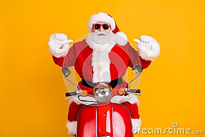 Portrait of his he nice confident cheerful Santa riding moped pointing at himself St Nicholas December tradition Stock Photo