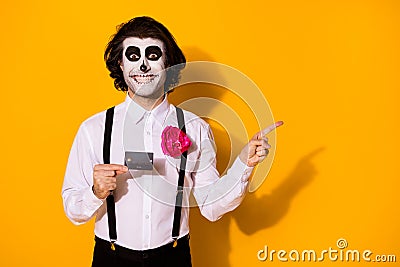 Portrait of his he nice handsome spooky cheerful cheery glad guy holding in hands plastic card money transfer showing Stock Photo
