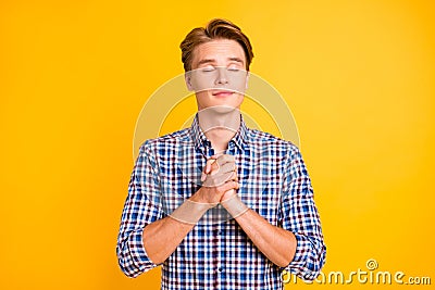 Portrait of his he nice-looking attractive dreamy lovely guy wearing checked shirt praying imagine desirable pleasant Stock Photo