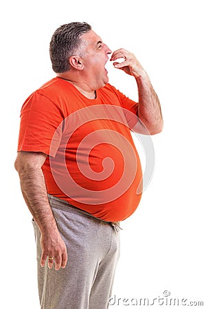 Portrait of a hungry overweight man Stock Photo