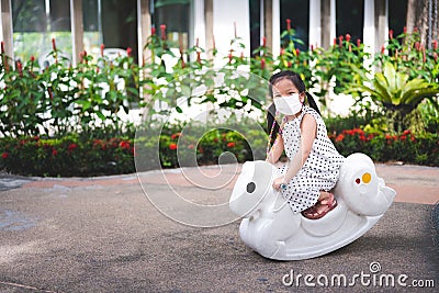 Portrait image child 5 years old. Kid wearing medical face mask to prevent toxic dust pm2.5. Stock Photo