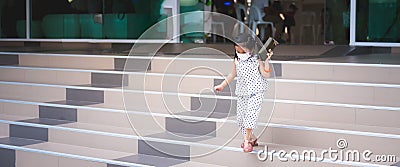 Portrait image child 5-6 years old. Little girl wearing white face mask for prevent toxic dust pm2.5 and virus. Stock Photo