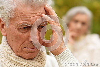 Portrait of an old man having a headache Stock Photo