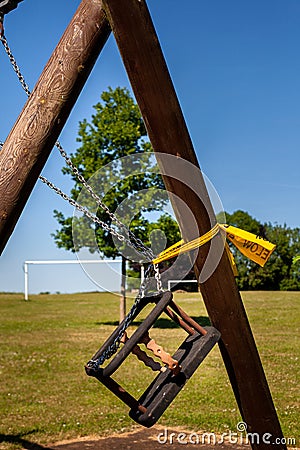 Tied up Swing in Park During Lockdown Portrit Stock Photo