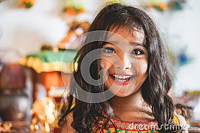 Portrait of indian female kid wearing sari dress - Southern asian child having fun smiling in front of camera - Childhood, Stock Photo