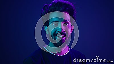 Portrait Indian man standing in profile side view turn to camera smiling toothy happy guy developer coding smile Stock Photo