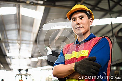 Portrait of industrial worker standing with tablet holding in her hand feeling proud and confident looking for the new opportunity Stock Photo