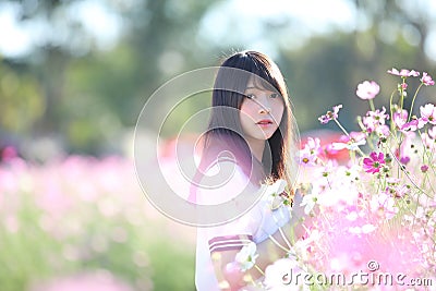 Portrait of Japanese school girl uniform with cosmos flower Stock Photo