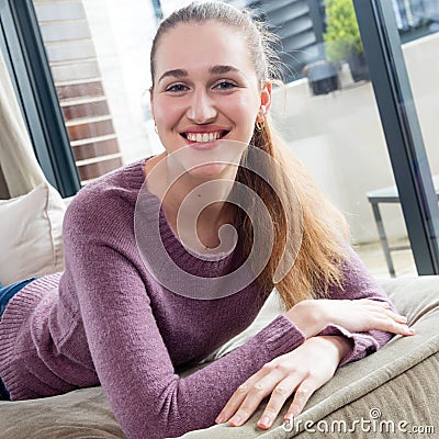 Portrait of joyful gorgeous girl lying down enjoying free time Stock Photo