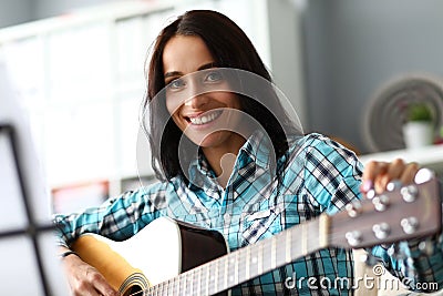 Smiling woman with guitar Stock Photo