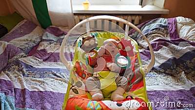 Portrait of just born baby in pink blouse lying in a cradle Stock Photo