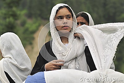 Portrait of a kashmiri girl who wears a white veil from Srinagar Editorial Stock Photo