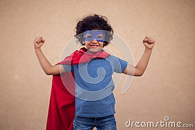 A portrait of kid boy in costume of superhero. Childhood and success concept Stock Photo