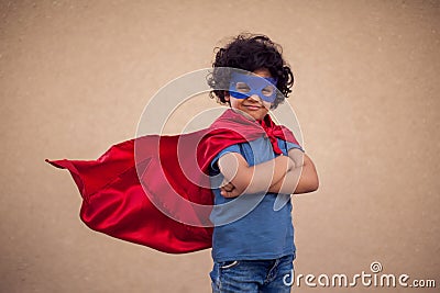 A portrait of kid boy in costume of superhero. Childhood and success concept Stock Photo