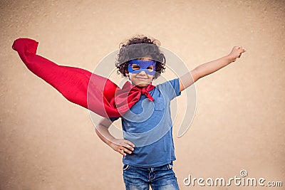 A portrait of kid boy in costume of superhero. Childhood and success concept Stock Photo