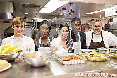 Portrait Of Kitchen Staff In Homeless Shelter Stock Photo