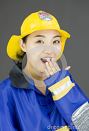 Portrait of a lady firefighter looking shocked Stock Photo