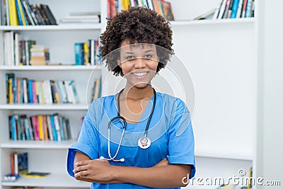 Portrait of laughing african american nurse at work Stock Photo