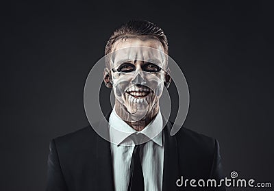Portrait laughing businessman with makeup skeleton Stock Photo