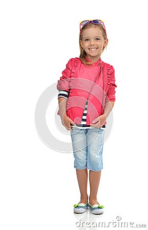 A portrait of laughing fashion little girl full body standing in Stock Photo