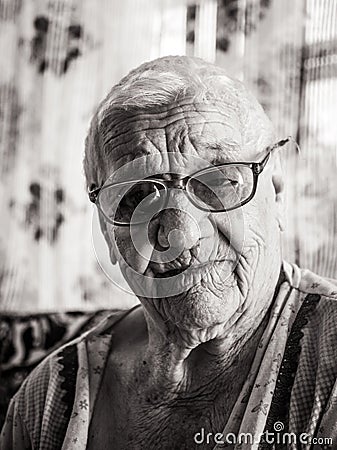 Portrait of a laughing hundred-year-old retired woman Stock Photo