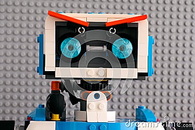 Portrait of Lego BOOST robot against gray baseplate background Editorial Stock Photo