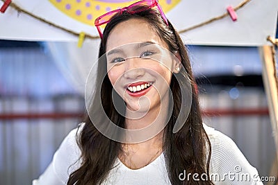 Portrait of a young asian woman smiling to the camera in a store Stock Photo