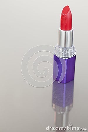 Portrait of a lipstick with a purple tube Stock Photo