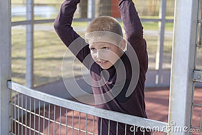 Portrait of a litte blond boy on playground Stock Photo