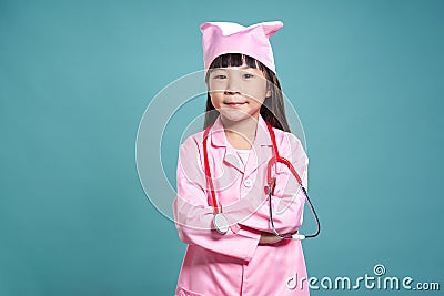 Portrait of a little asian girl in a doctors uniform Stock Photo