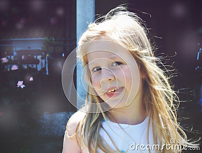 Portrait of a little blonde smiling girl; soft retro style Stock Photo