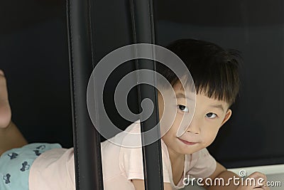 Little boy crawling under the chair.Playful time Stock Photo