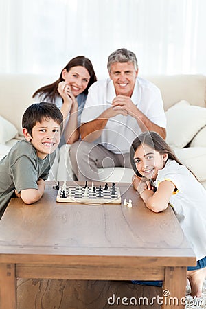 Portrait of a little family in their living room Stock Photo