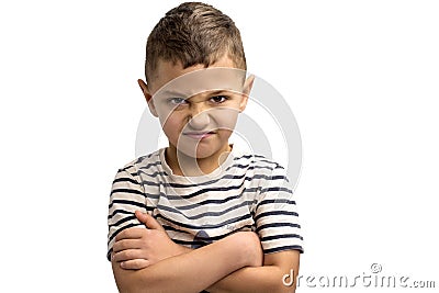 Portrait of a little frowning boy on a white background. Emotions Stock Photo