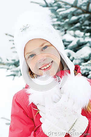 Portrait of little girl with blonde hair in winter. Stock Photo