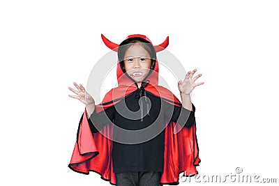 Portrait little girl dressed Halloween costume with face make up. Kid in Dracula robe with frightening expression on Stock Photo