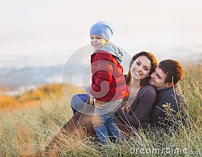 Portrait of the little girl with a funny hat and father and moth Stock Photo