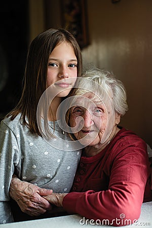 Portrait of little girl and her grandmother. Love. Stock Photo
