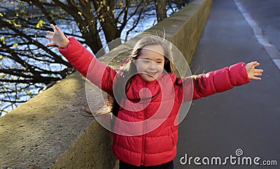 Portrait of little girl smiling in the city. Editorial Stock Photo