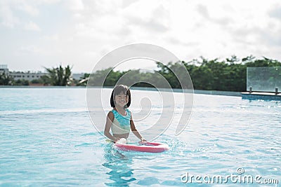 Portrait little girl trying learn swimming Stock Photo