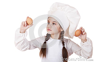 Portrait of a little girl in a white apron holding two chicken e Stock Photo
