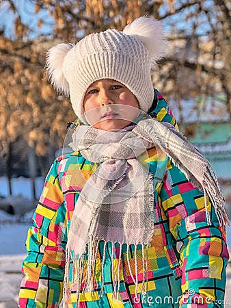 Portrait of a little girl in winter clothes Stock Photo