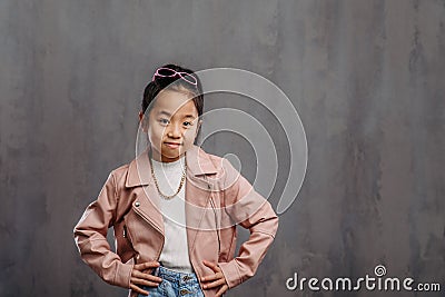 Portrait of little japanesse girl with leather jacket. Stock Photo